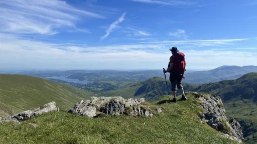 Photo of Stephen Purkiss half way round the Fairfield Horseshoe looking down over Lake Windermere in the distance